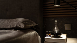 FLO Diffuser Home on top of a bedside table.
