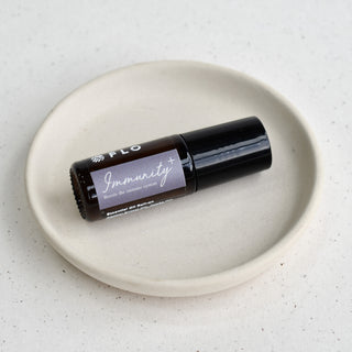 5ml Immunity+ Essential Oil Roll-On with cap on.
