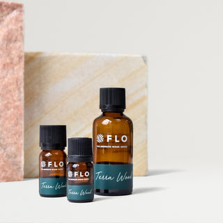 Bottles of 5ml, 10ml, and 50ml Terra Wood Essential Oil Blend.