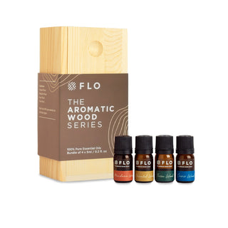Mandarin Wood, Oriental Wood, Terra Wood, and Oasis Wood Essential Oil Blends with wooden box.