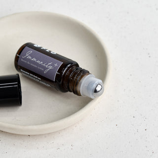 5ml Immunity+ Essential Oil Roll-On with cap off.