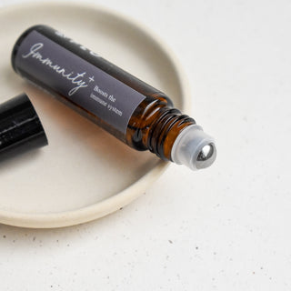 10ml Immunity+ Essential Oil Roll-On with cap off.