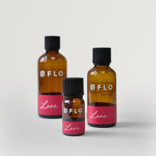 Bottles of 10ml, 50ml, and 100ml Love Essential Oil Blend.