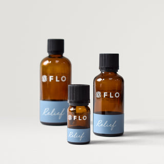 Bottles of 10ml, 50ml, and 100ml Relief Essential Oil Blend.